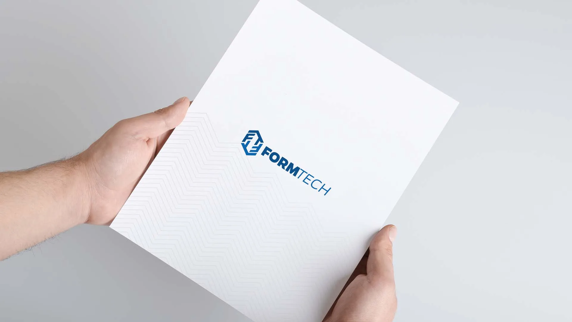Formtech letterhead held in hands